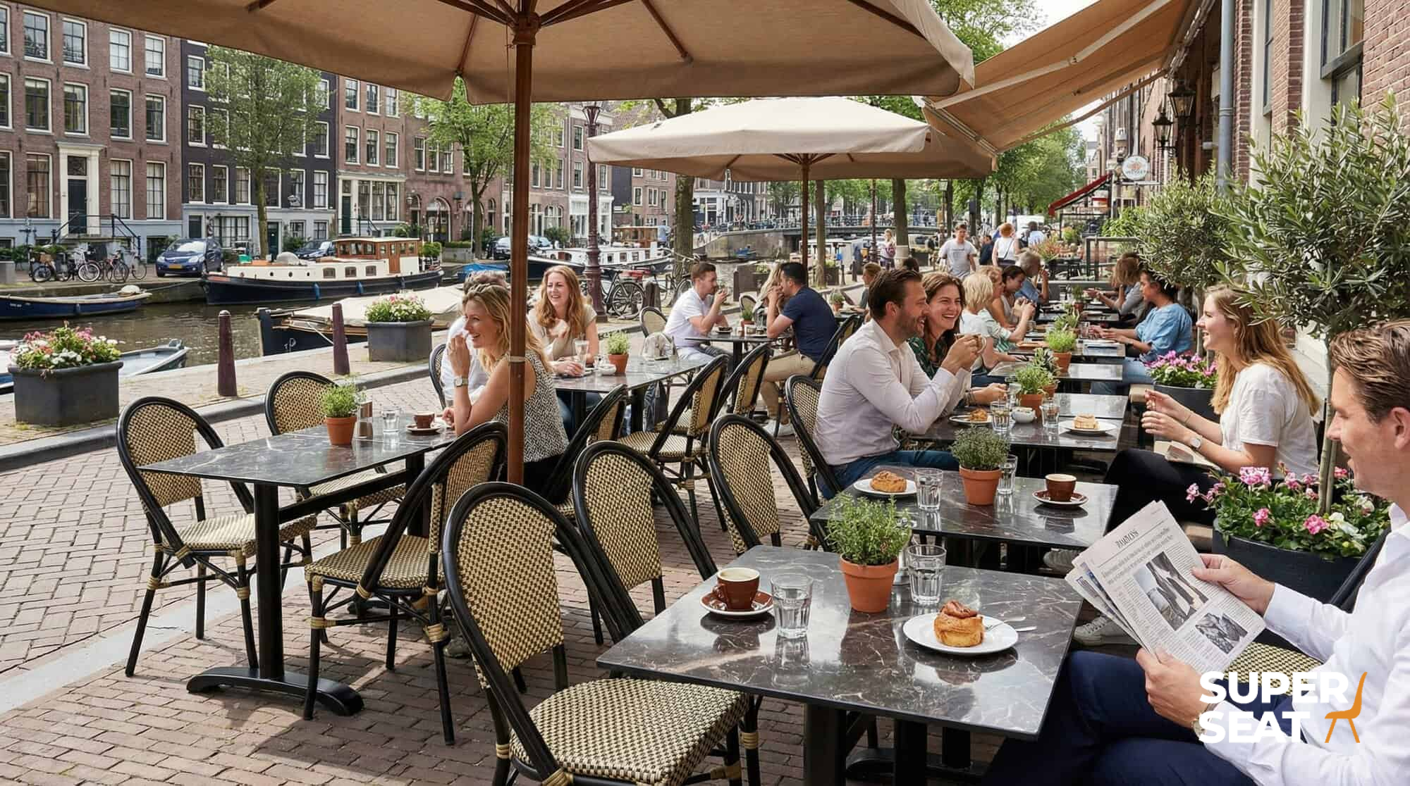 Super-Seat |Cast iron 4 teens (patio) table bases Paris black|Black cast iron tables and chairs, metal frames, by the water in the sun. | Hospitality Furniture