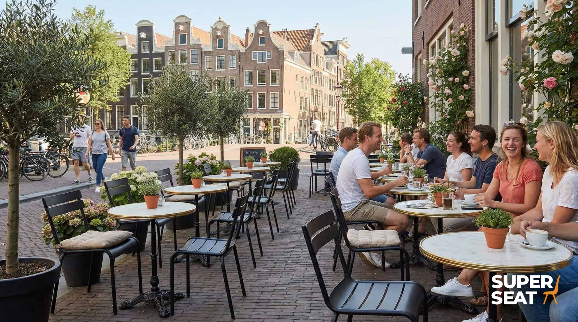 Super-Seat | Black metal stacking chairs and tables on a clinker terrace with plants and city views. | Hospitality Furniture