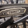 Super-Seat | Close-up Thonet Label on Vintage Bentwood Armchairs | Mocha hout, gebogen frame, zwart-wit label, klassieke beukenhouten armstoelen. | Horecameubilair