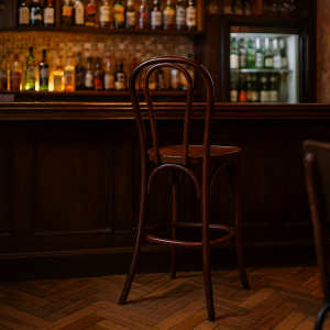 Super-Seat | A Vienna Thon no 18 wooden bar stools brown | Brown wooden bar stools at dark wood bar, glasses and bottles on shelves, warm lighting. | Hospitality Furniture