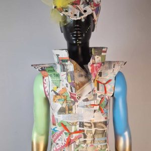 Super-Seat | Mannequin with garish outfit of newspaper, tulle & decorative stones; arms painted blue-gold. | Hospitality Furniture